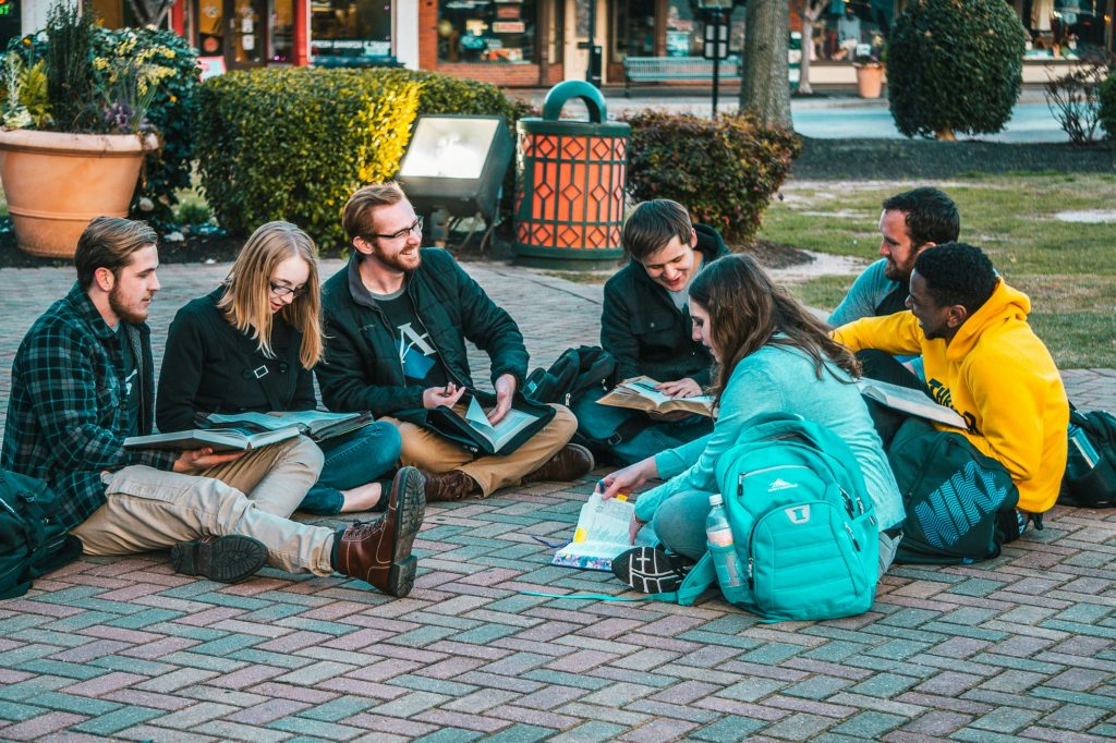 group of students sitting on the ground in Dublin