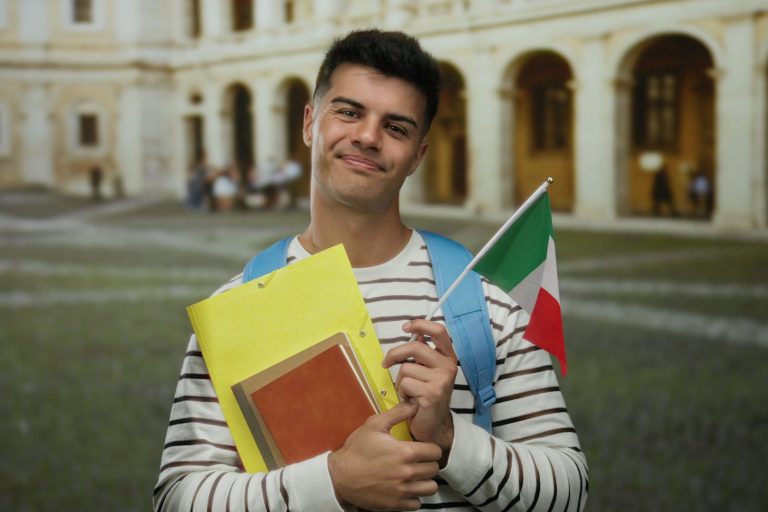 A young male student holing Italian Flag